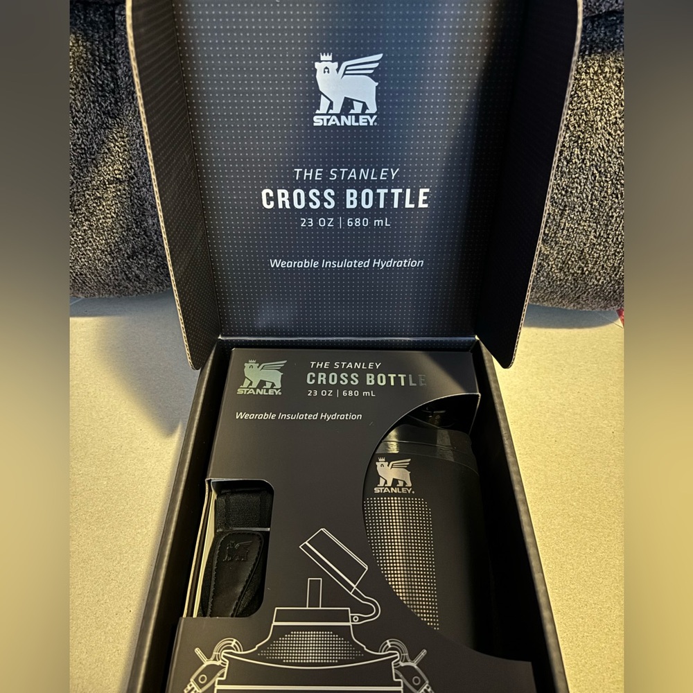 Black Stanley cross bottle with strap